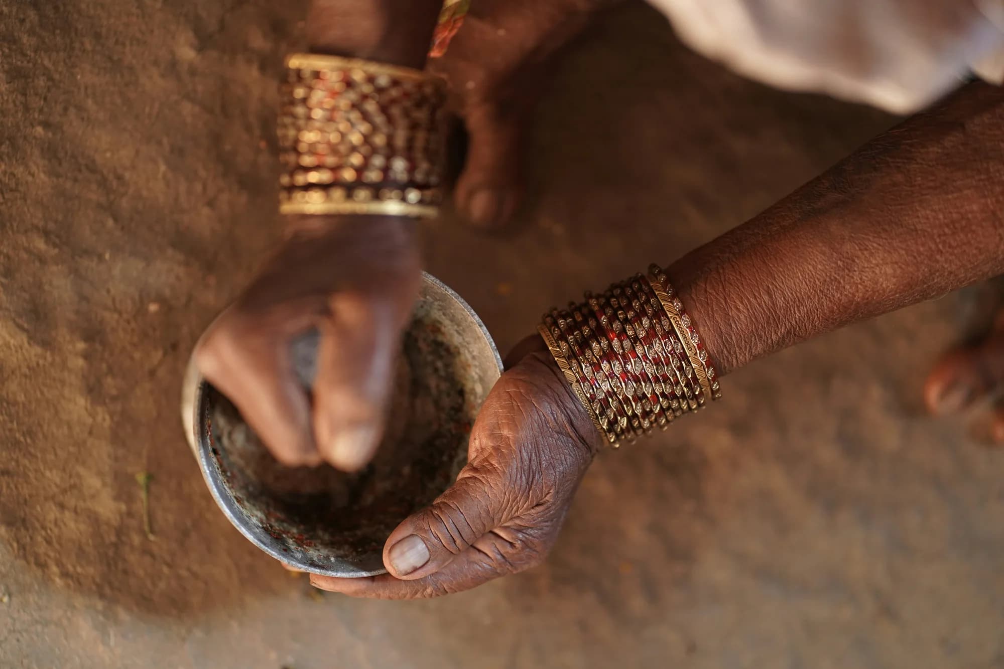 Hands grinding spices — representative photo, not taken at Bantawala by Masala Twist