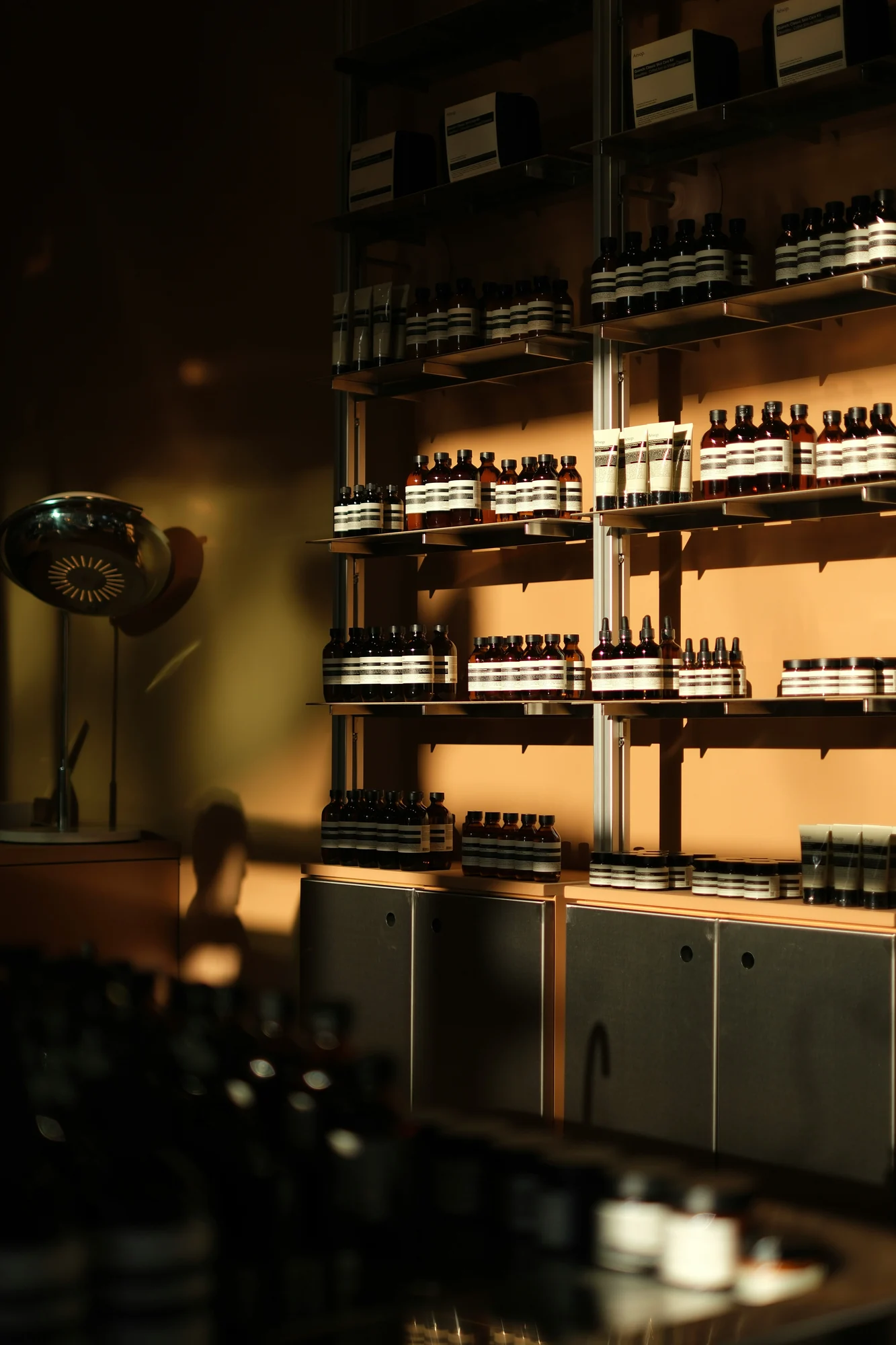 Bottles of skincare products displayed on shelves. — representative photo, not taken at Boots — St. Enoch