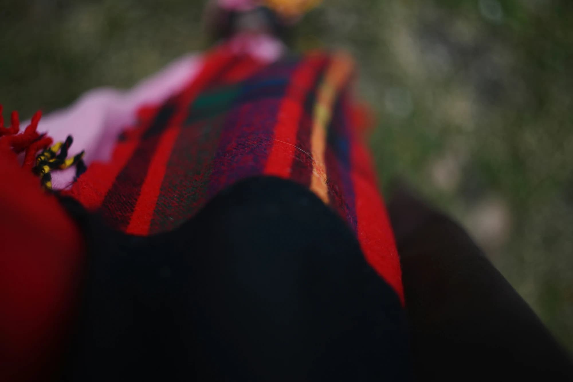 Close up of a plaid scarf with red fringe — representative photo, not taken at Born in Scotland — St. Enoch