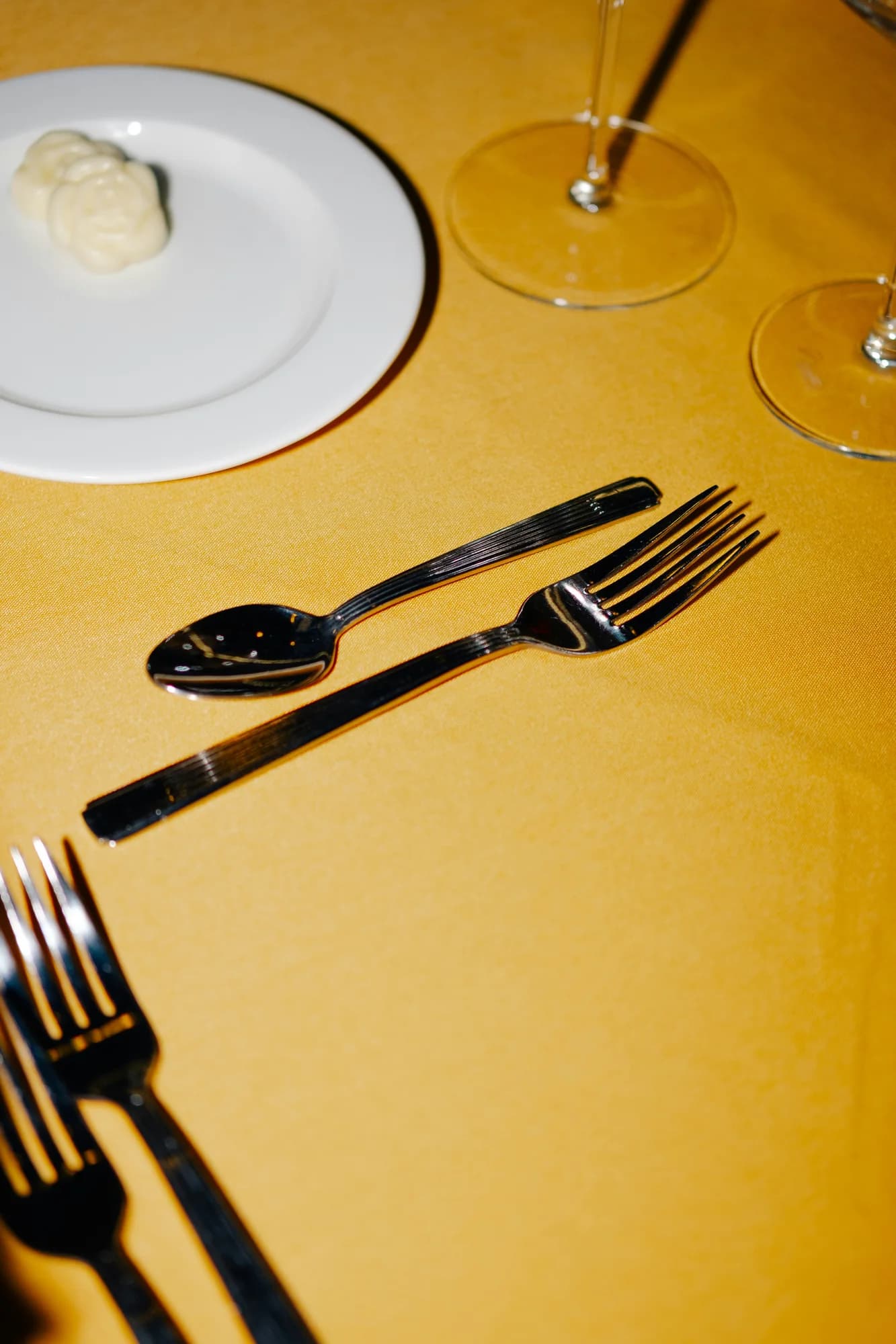 Silverware, plate and wine glasses — representative photo, not taken at Cail Bruich