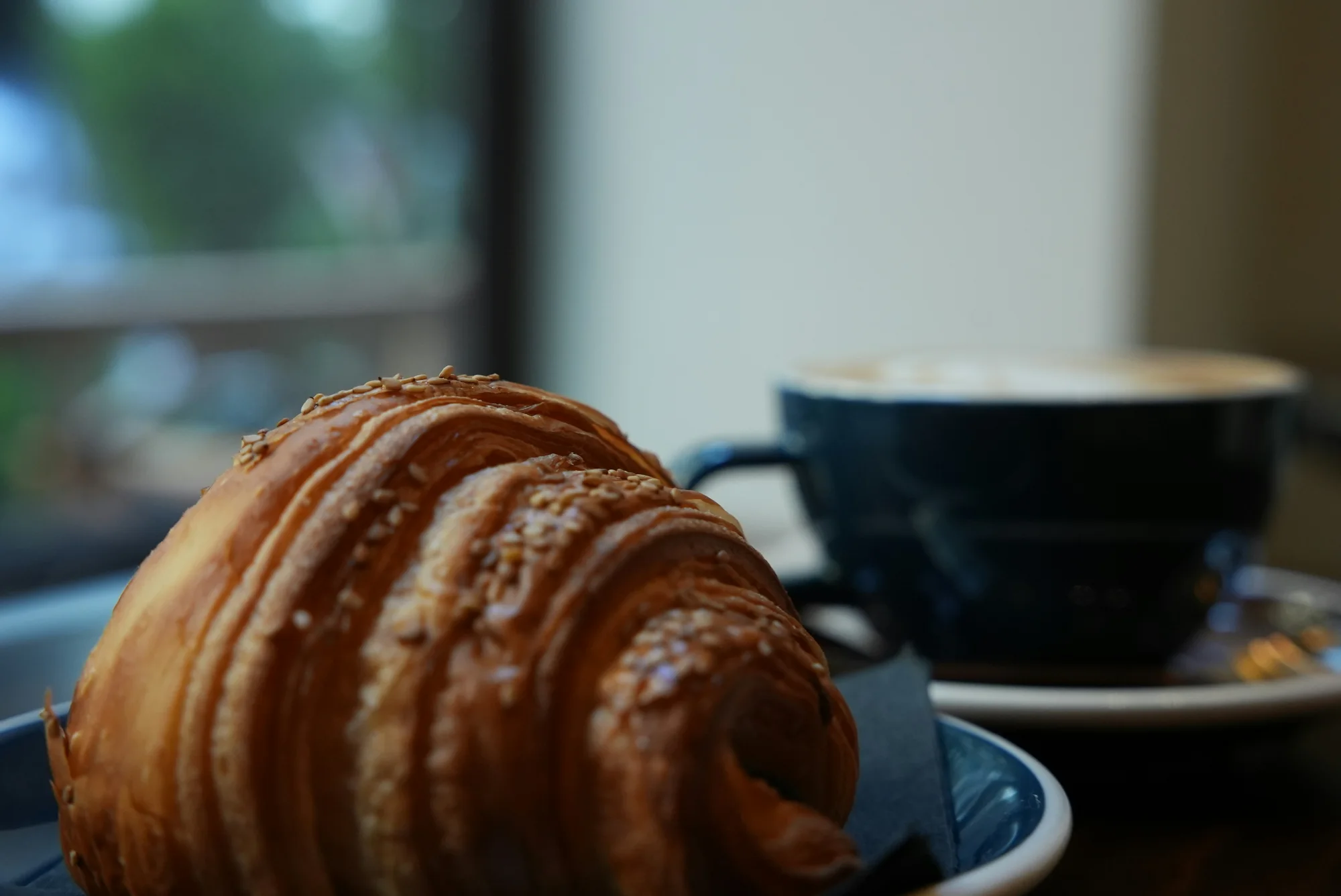 Coffee and croissant — representative photo, not taken at Coia’s Cafe