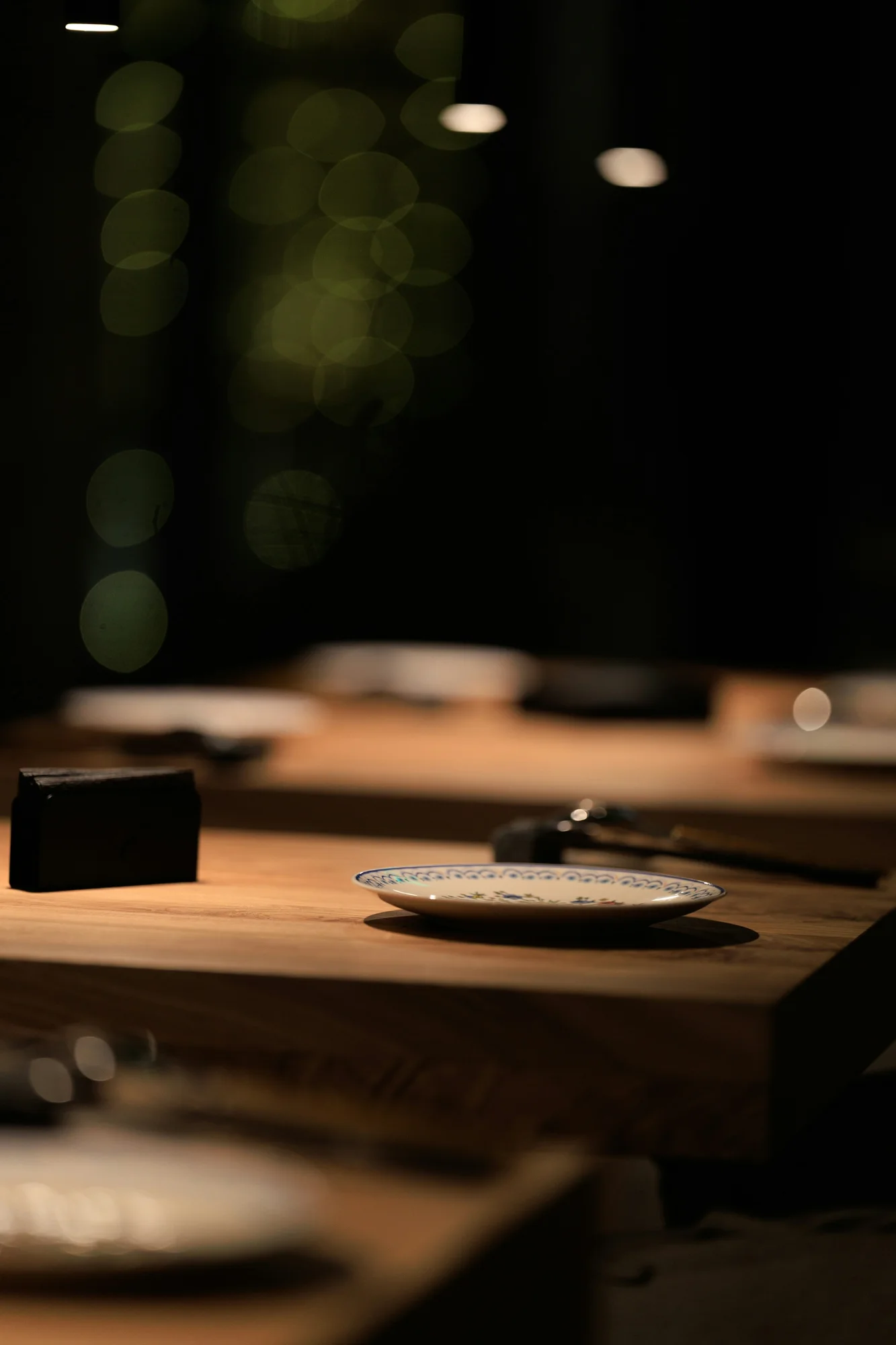 Dimly lit dining table — representative photo, not taken at Eleven Fifty Five