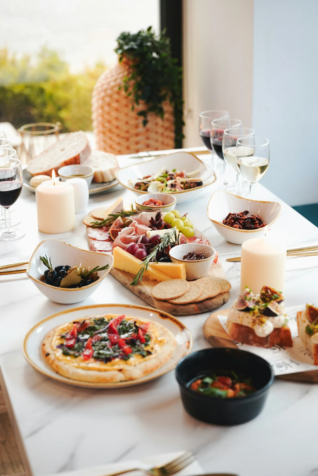 Charcuterie and sharing food on a table — representative photo, not taken at Five March