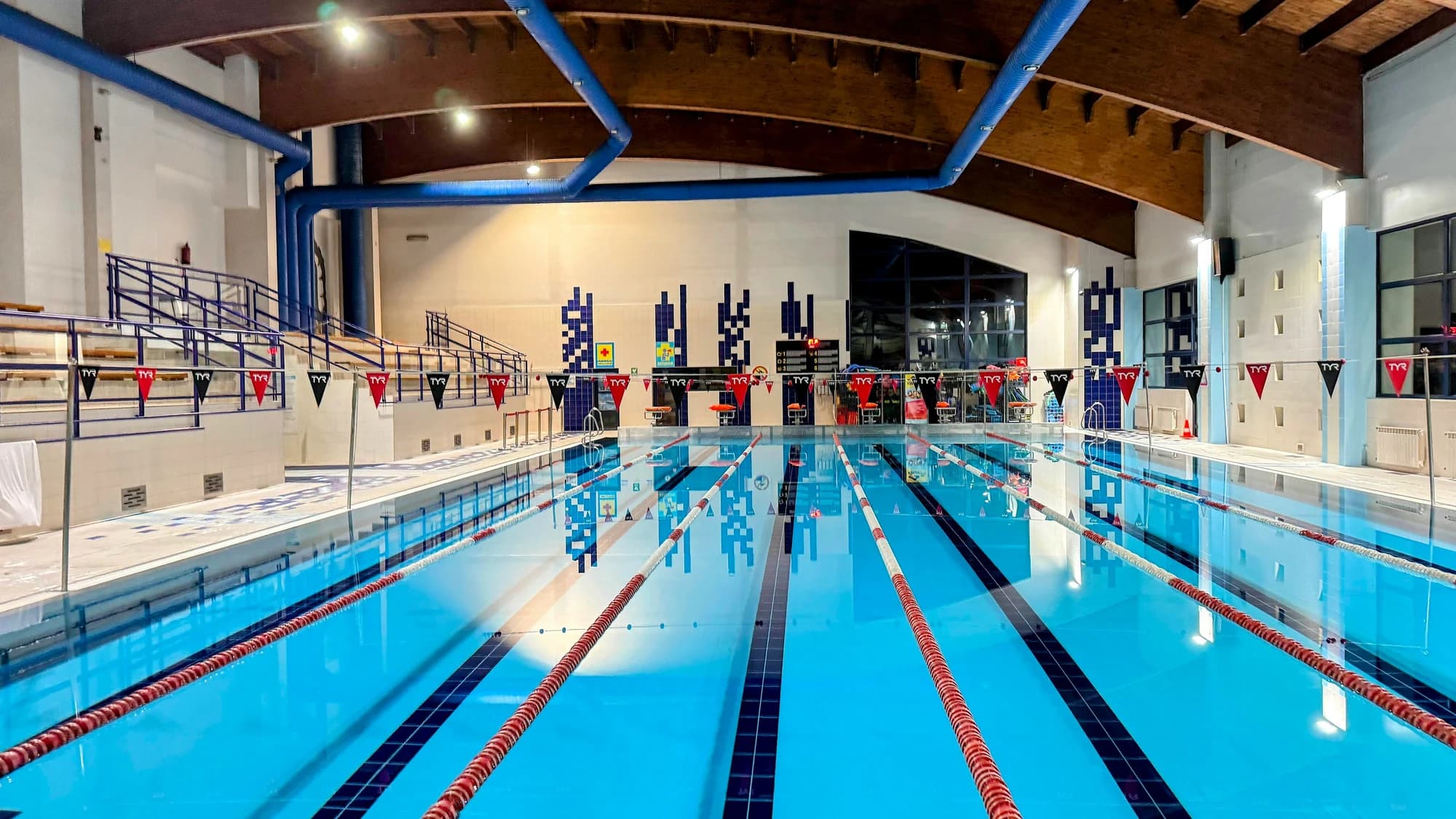 An indoor swimming pool with blue water — representative photo, not taken at Glasgow Club Easterhouse Pool