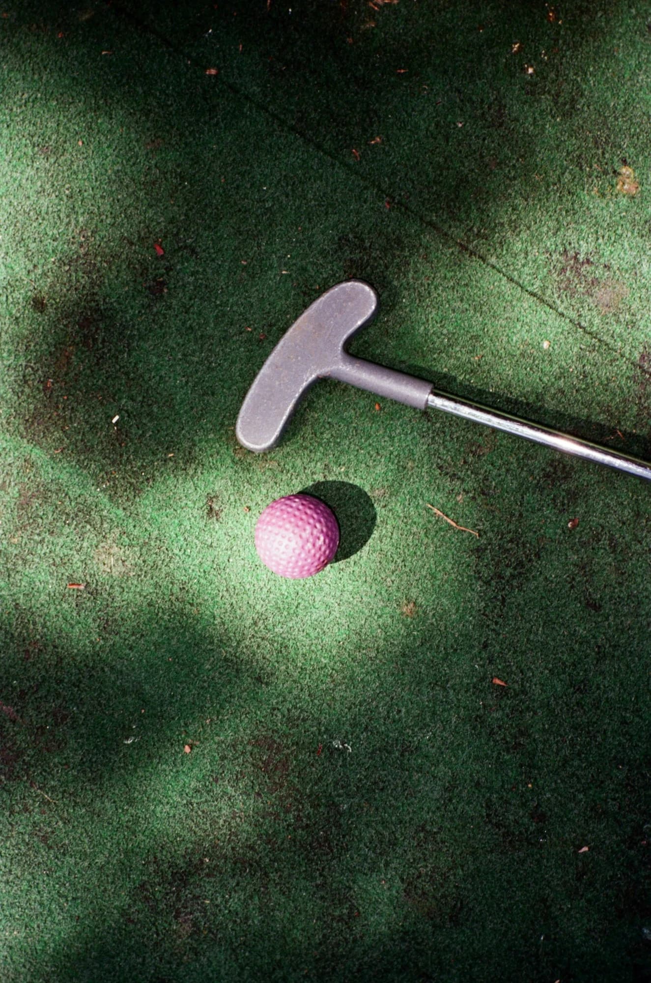Mini golf club and ball on green turf. — representative photo, not taken at Golf Fang Glasgow