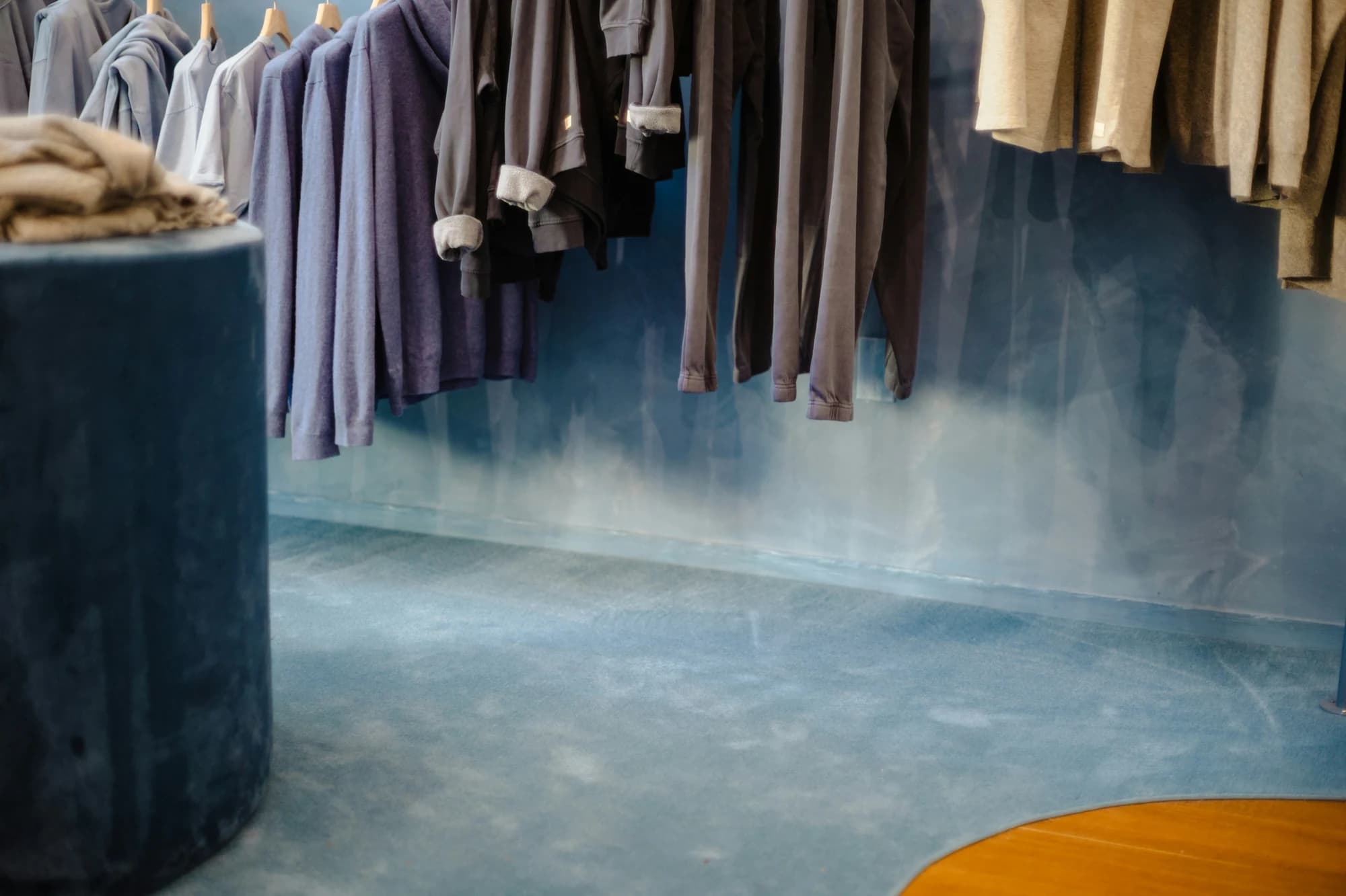 Clothing hanging on racks in a store. — representative photo, not taken at H&M — St. Enoch