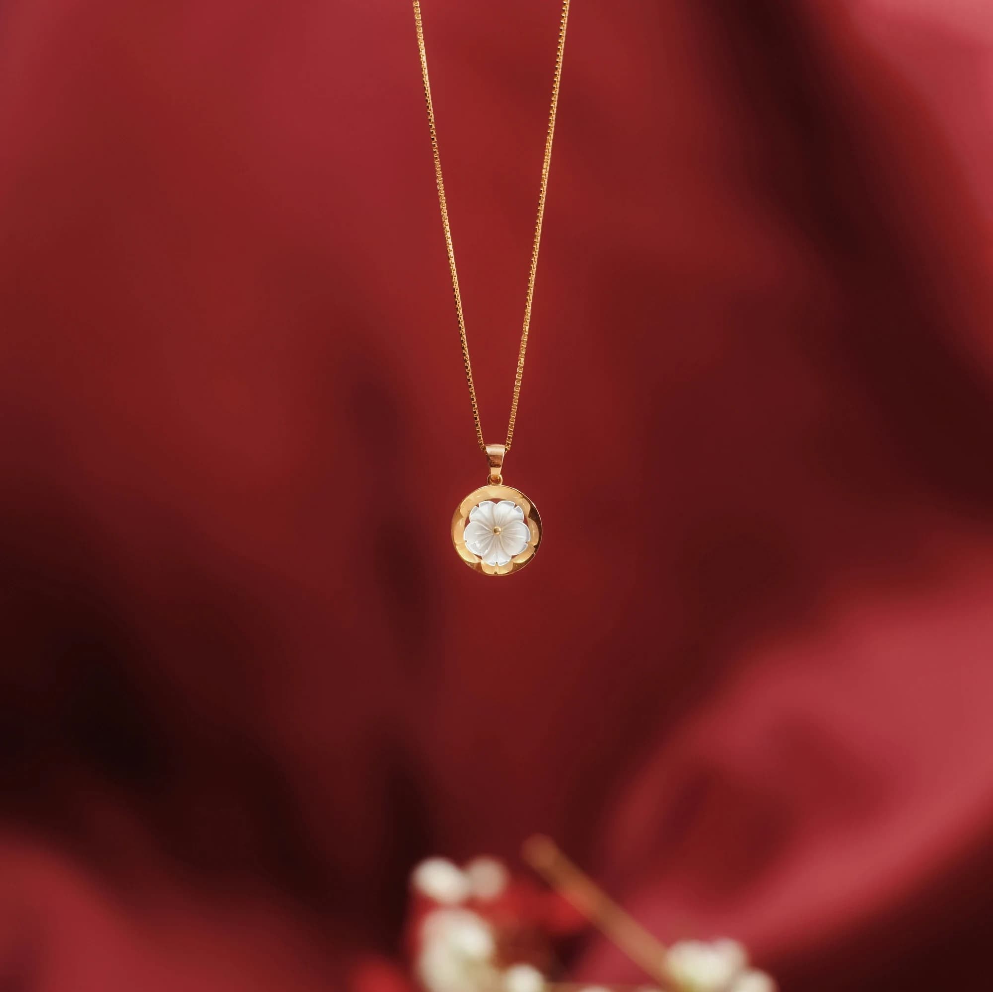 Rose gold necklace with a clear gemstone pendant. — representative photo, not taken at H. Samuel — St. Enoch