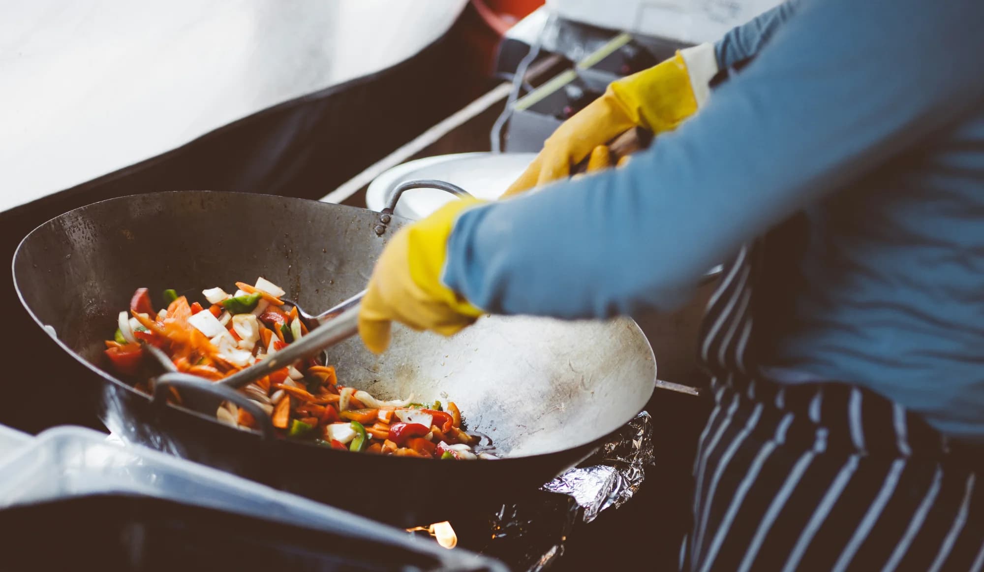 Vegetables being cooked in a wok — representative photo, not taken at Ka Pao Glasgow