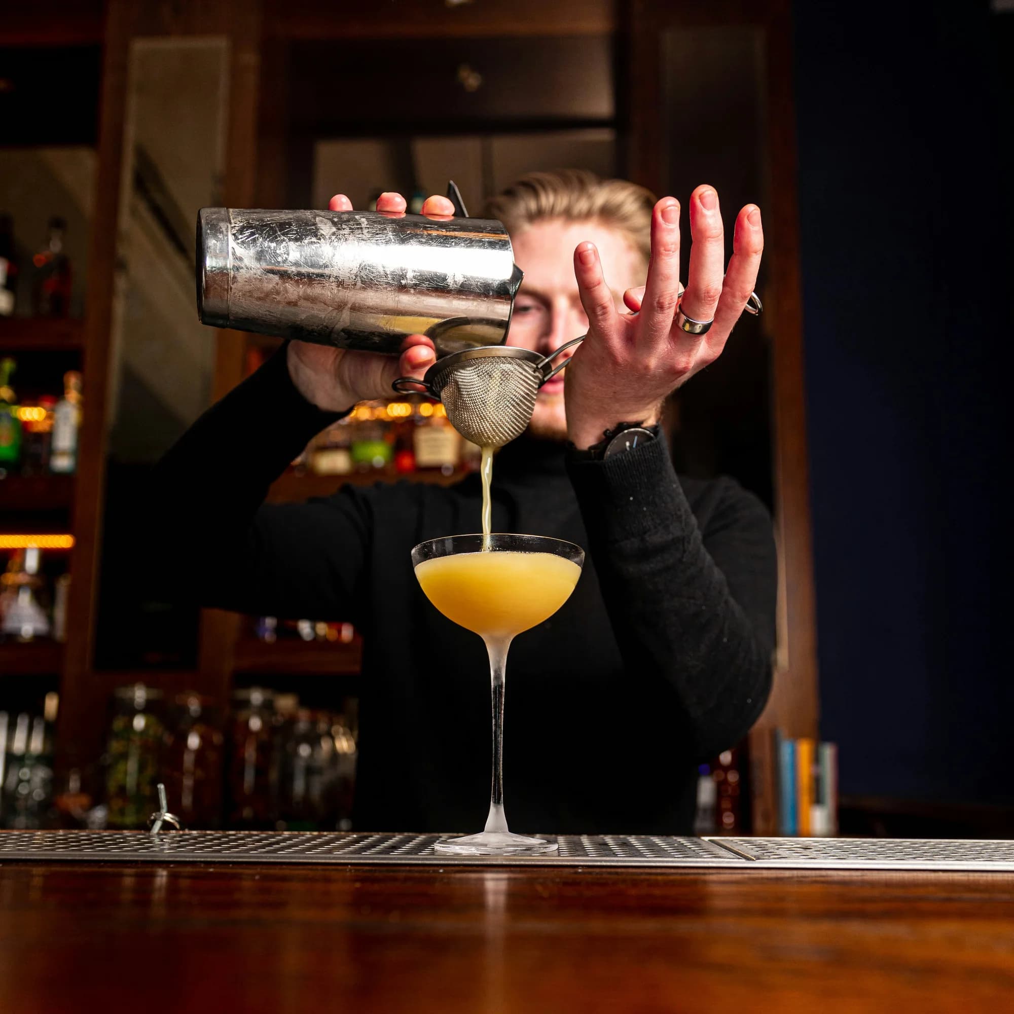 Cocktail being poured — representative photo, not taken at Lennox