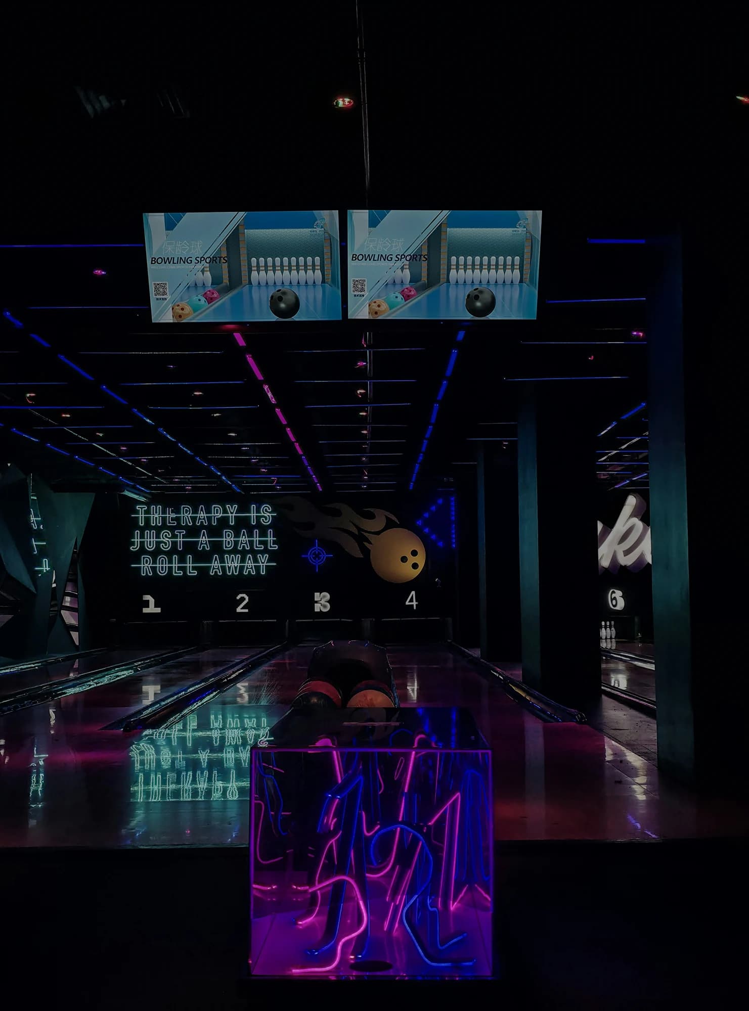 Neon-lit bowling alley with lanes and pins. — representative photo, not taken at Level X — St. Enoch