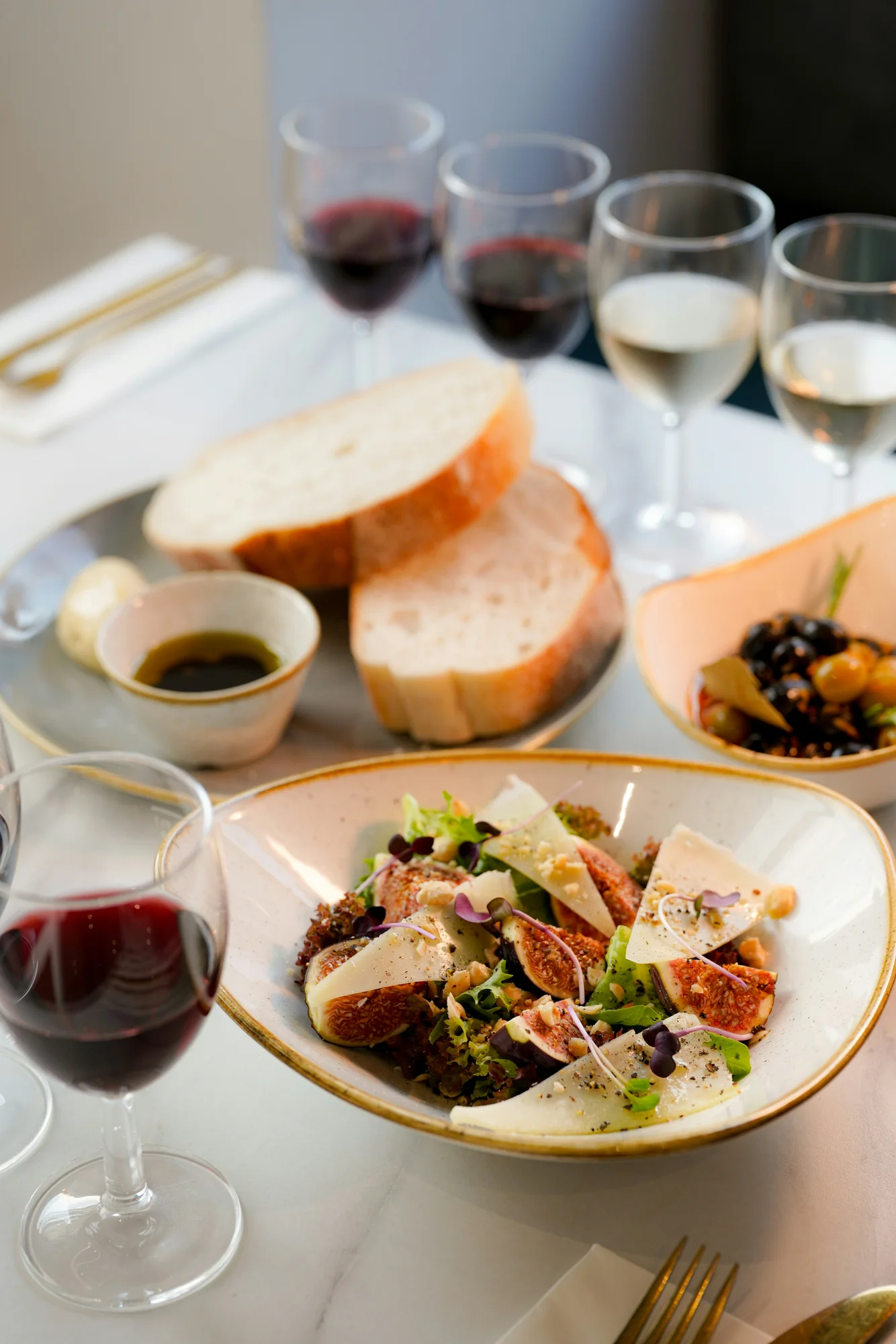 Salad, figs, cheese and bread — representative photo, not taken at Lobo