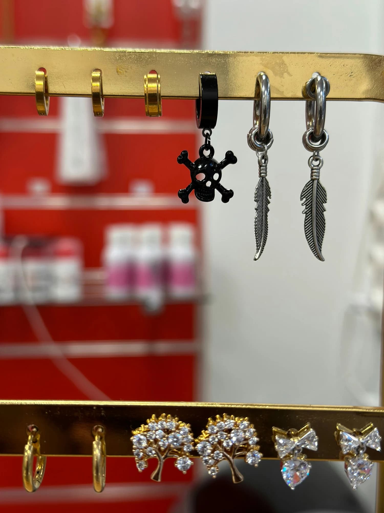 Various earrings displayed on a rack. — representative photo, not taken at Lovisa — St. Enoch
