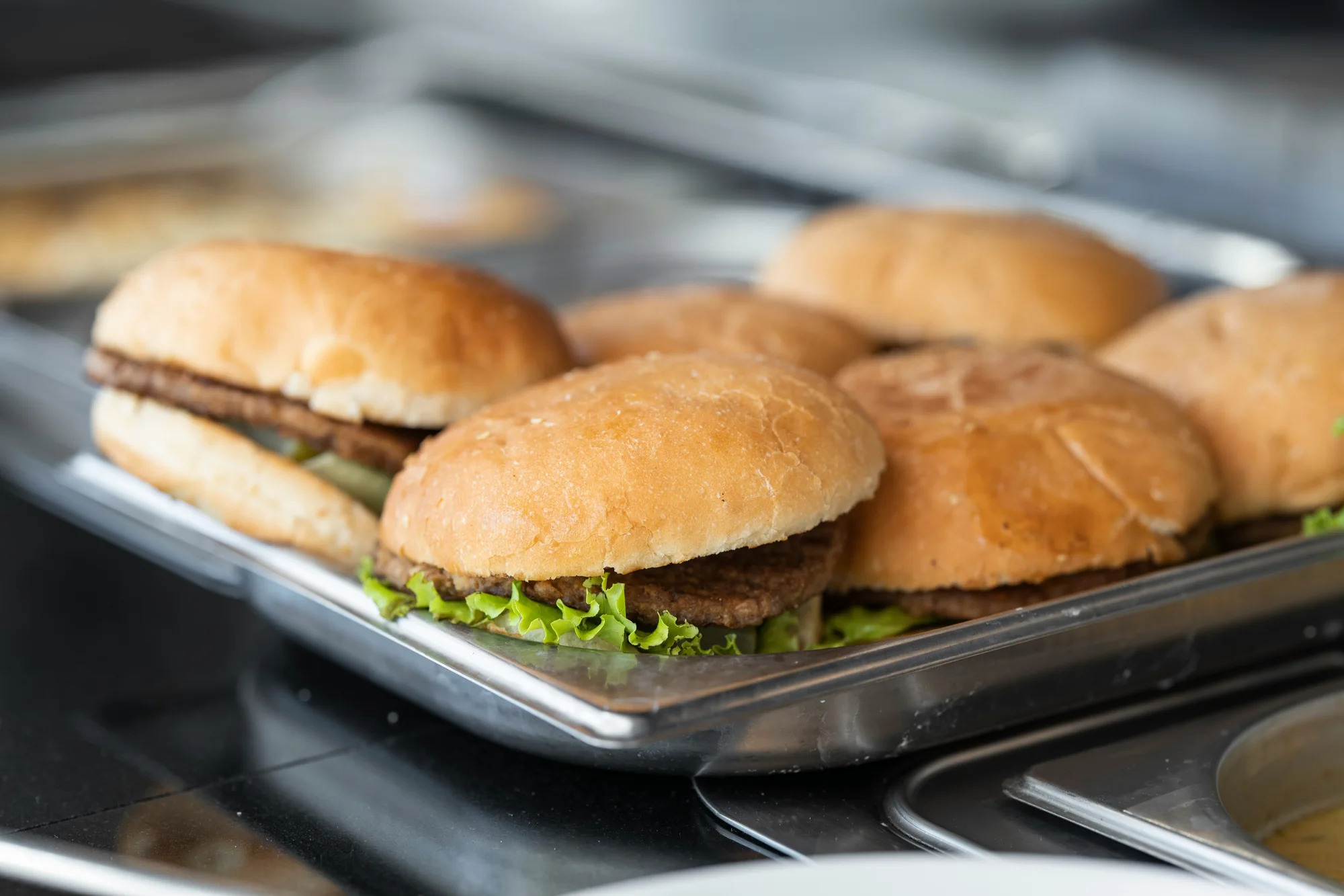 Burger on a metal tray — representative photo, not taken at Monteray Jacks — St. Enoch