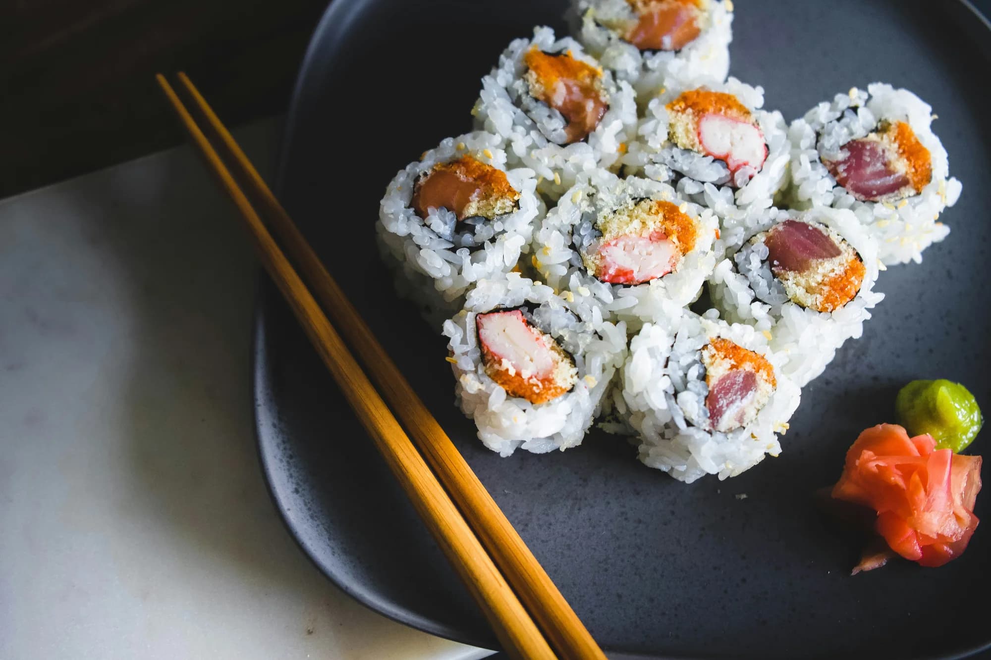 Sushi with chopsticks — representative photo, not taken at Nanakusa