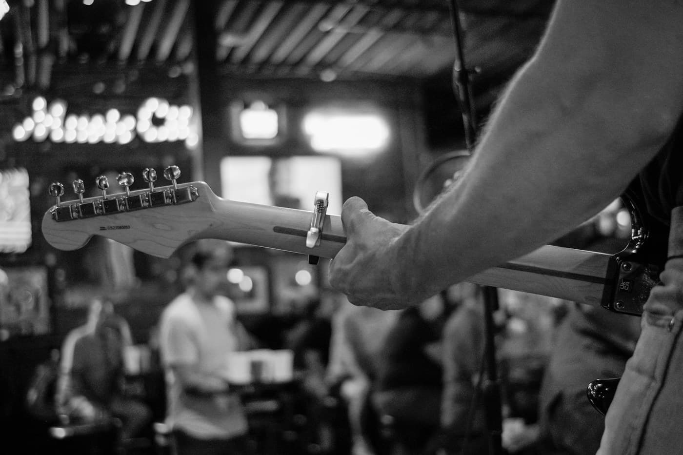 Guitarist performing in a live music bar — representative photo, not taken at Maggie’s Rock ’n’ Rodeo