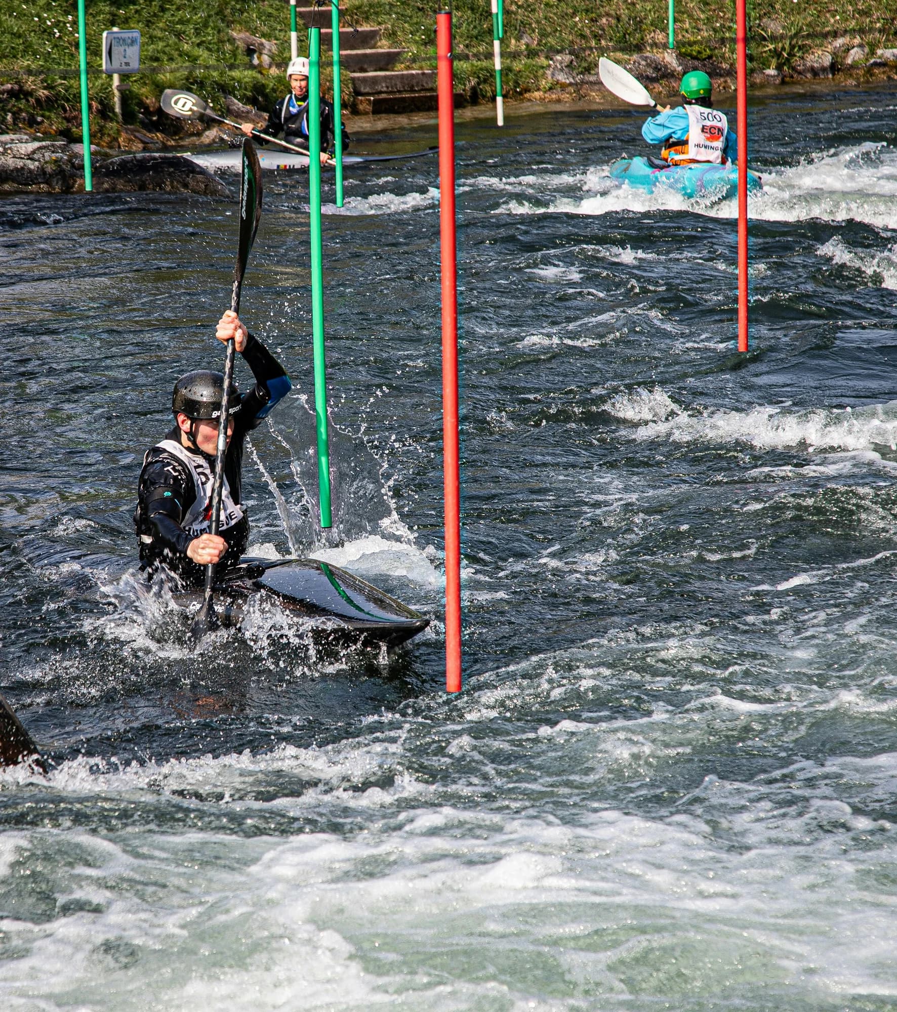 Kayaker navigates white water rapids with gates — representative photo, not taken at Pinkston Watersports