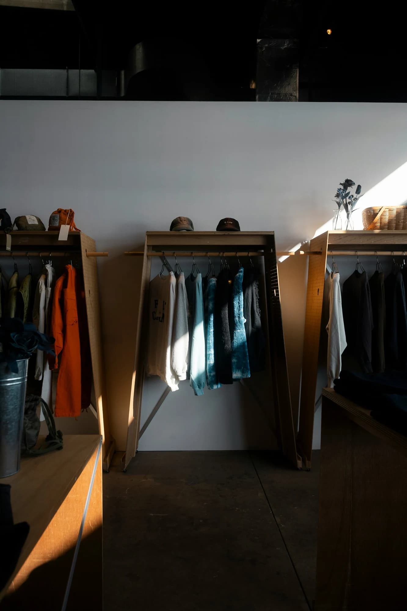 Clothing racks with apparel in a well-lit store — representative photo, not taken at River Island — Buchanan Galleries