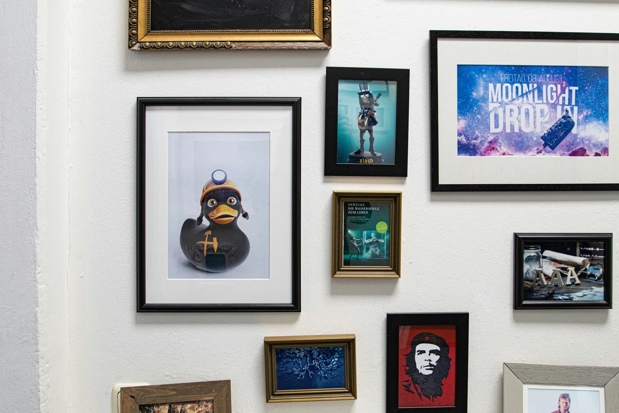 A bunch of framed pictures on a wall — representative photo, not taken at Rogues Gallery — St. Enoch