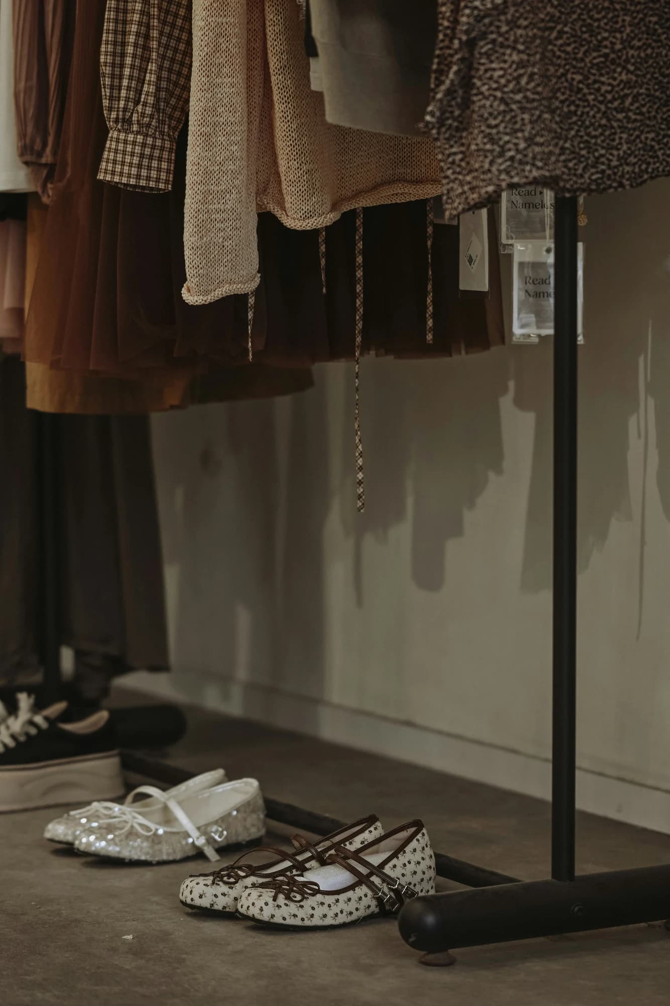 Children's shoes displayed on a store floor. — representative photo, not taken at Schuh Kids — St. Enoch