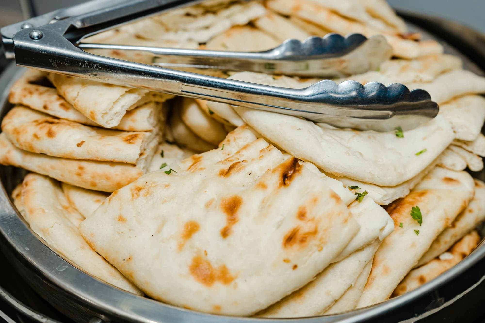 Naan bread in a bowl — representative photo, not taken at Shish Mahal