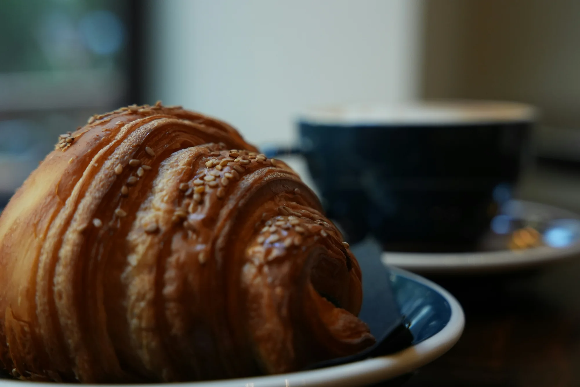 Croissant and coffee — representative photo, not taken at Singl-end