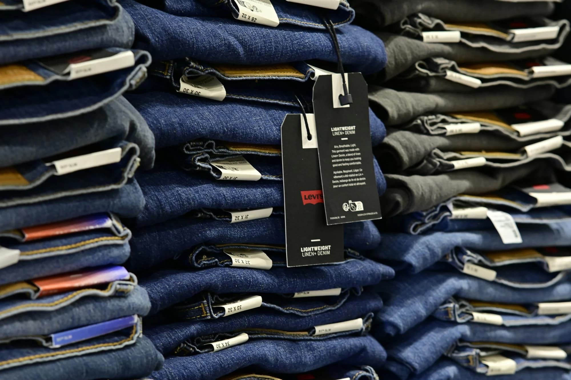 Piles of folded jeans ready for sale. — representative photo, not taken at Sorsa — St. Enoch