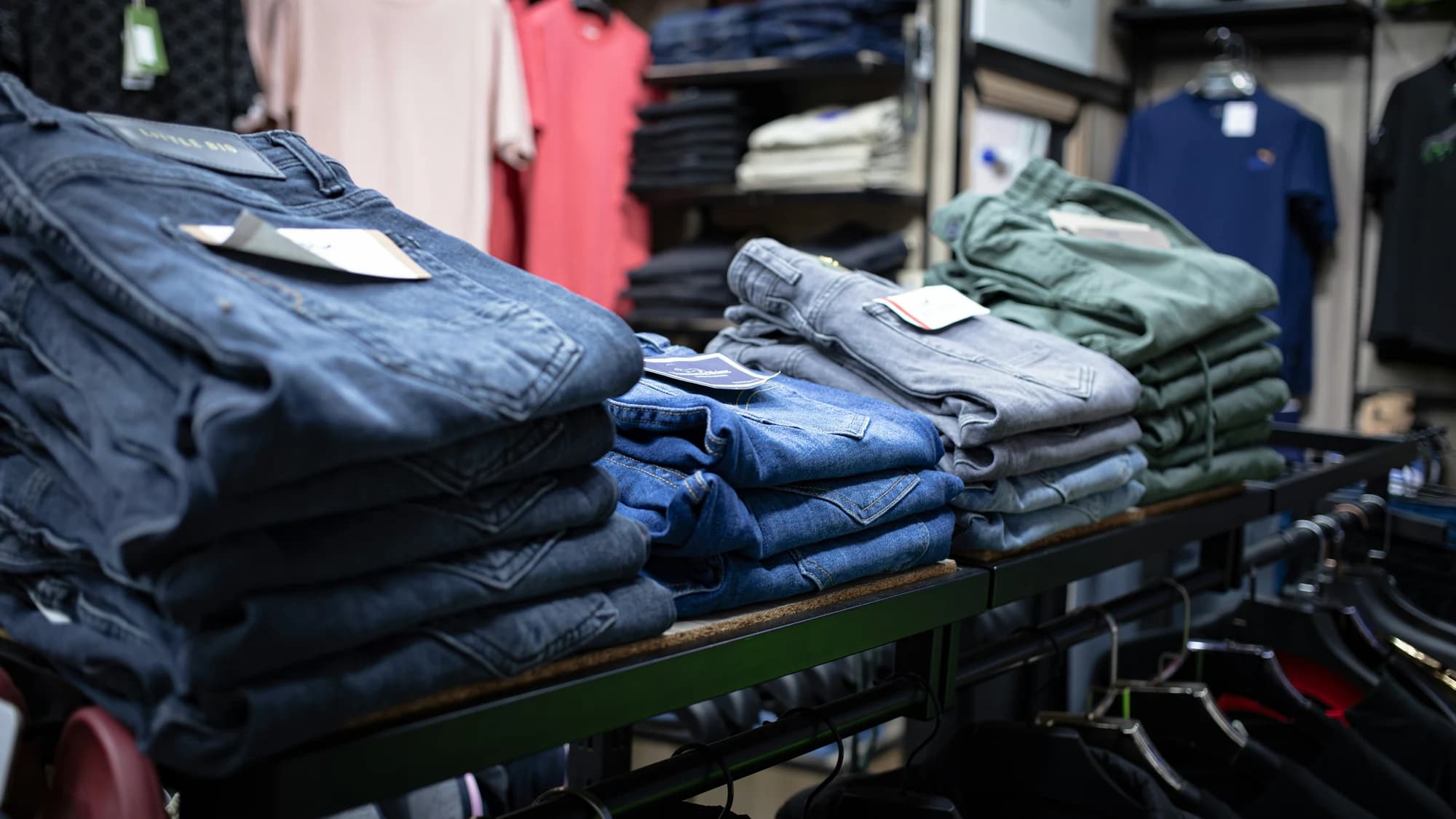 A rack of folded jeans in a clothing store — representative photo, not taken at Superdry — St. Enoch