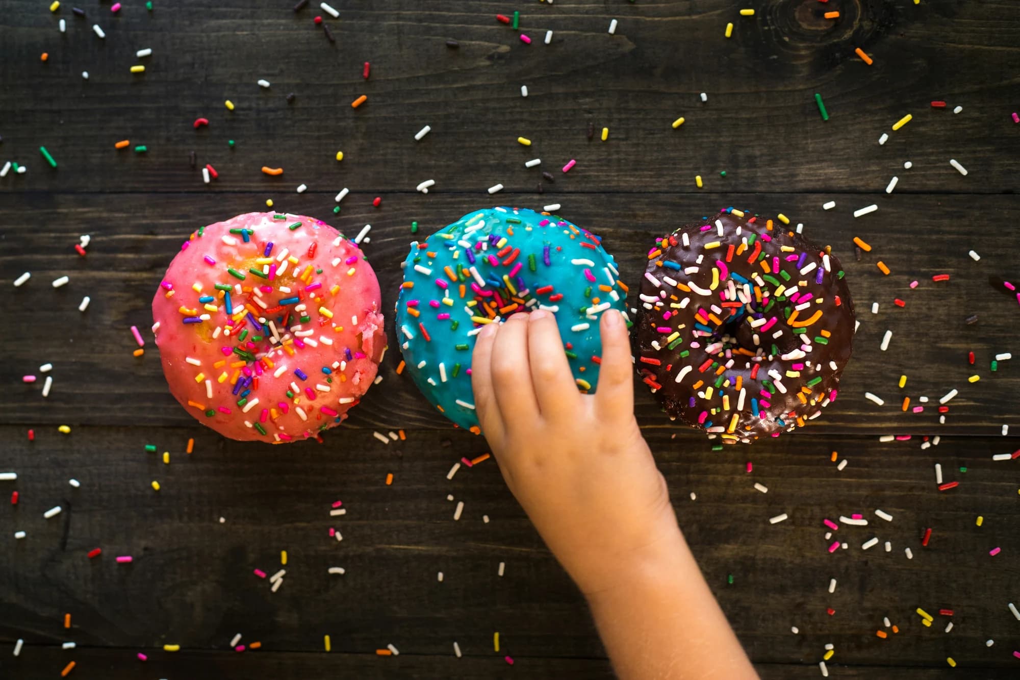 Three sprinkled doughnuts — representative photo, not taken at Tantrum Doughnuts — Shawlands
