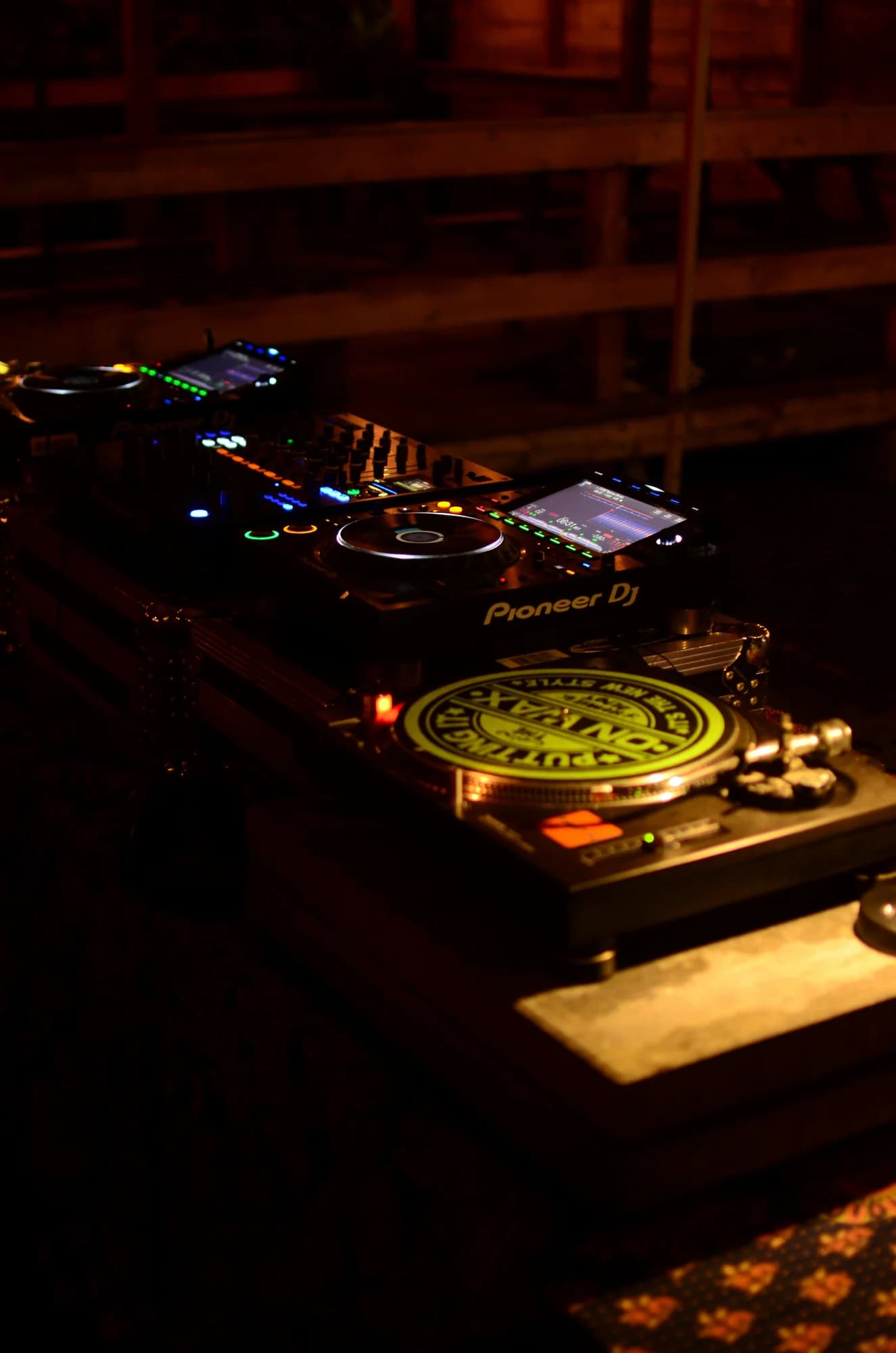 Dj equipment with glowing lights in a dark club. — representative photo, not taken at The Berkeley Suite