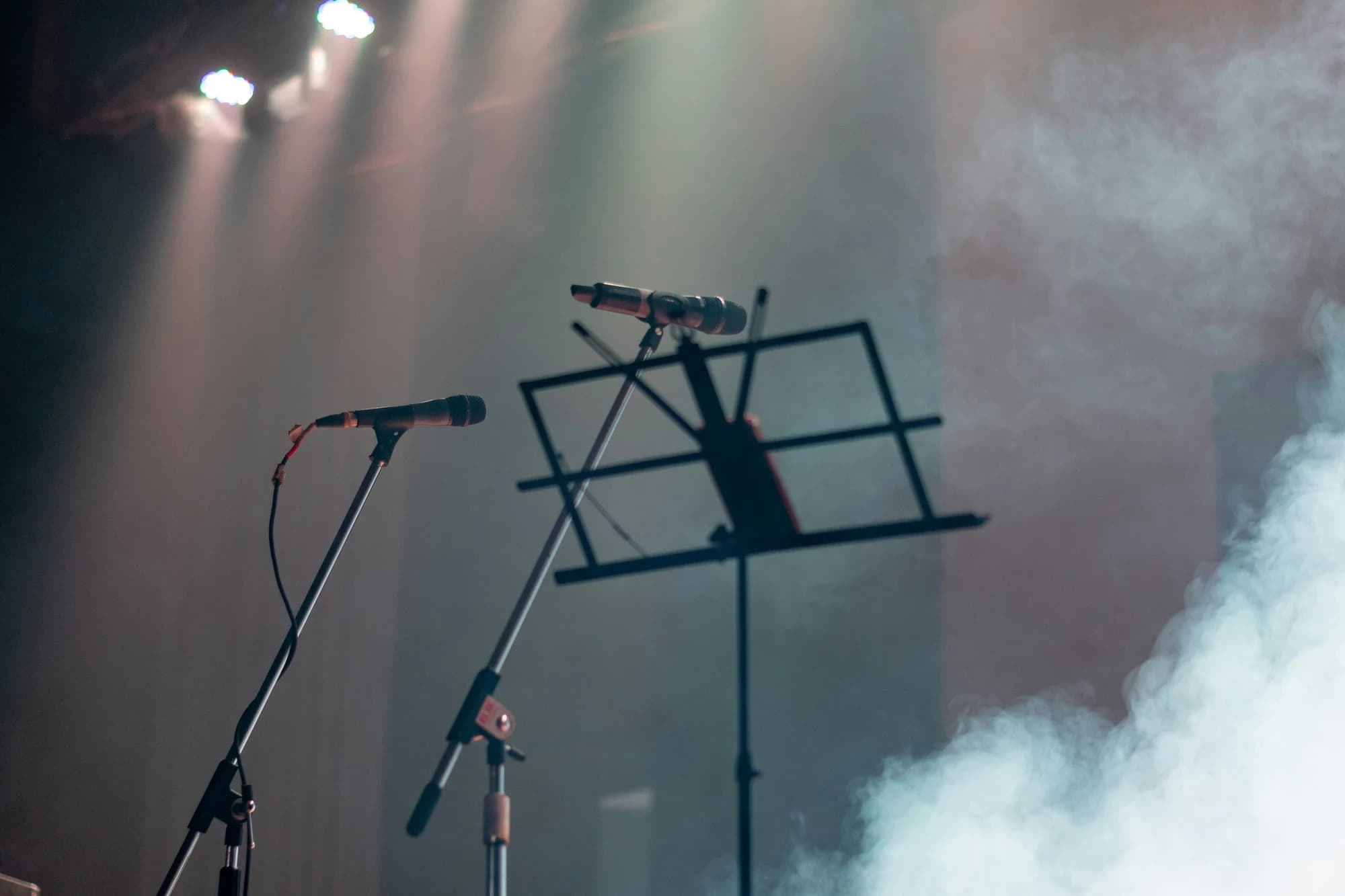 Microphone and music stand on a stage — representative photo, not taken at The Hug and Pint