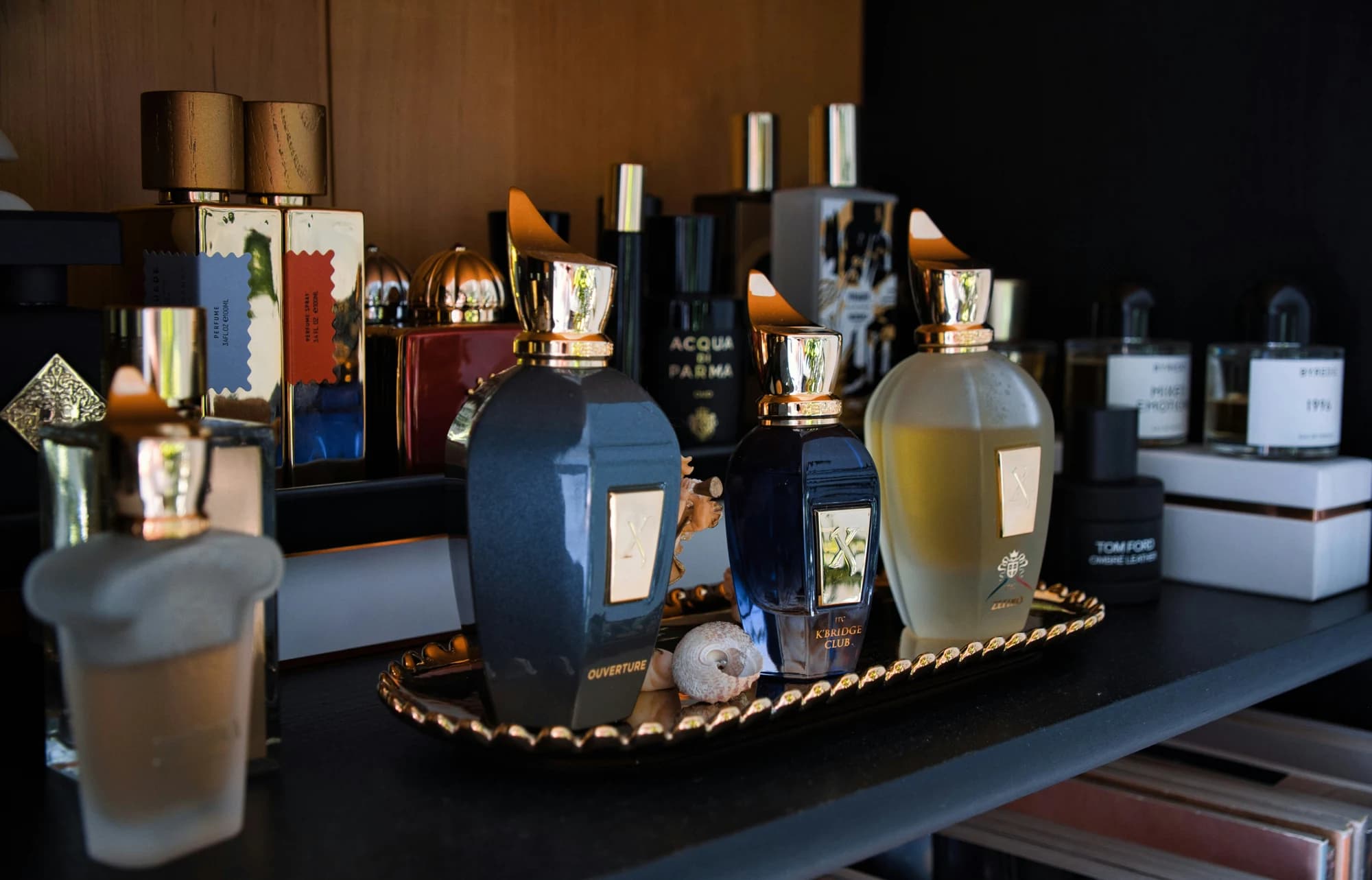 Collection of assorted perfume bottles on a shelf. — representative photo, not taken at The Perfume Shop — Buchanan Galleries