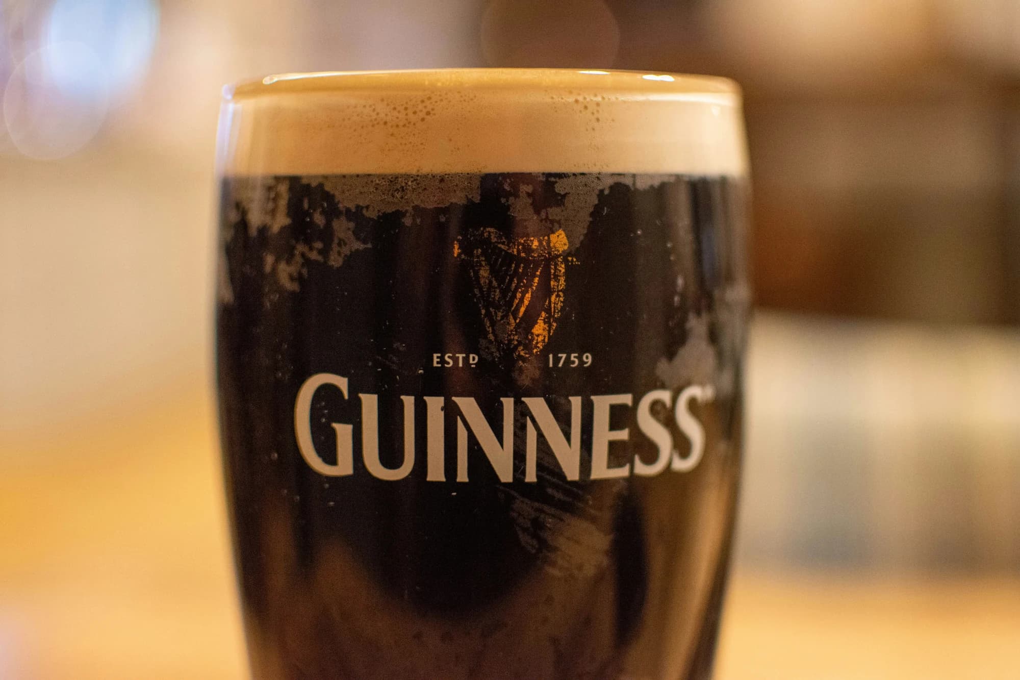 A glass of beer sitting on top of a table — representative photo, not taken at The Rose Reilly