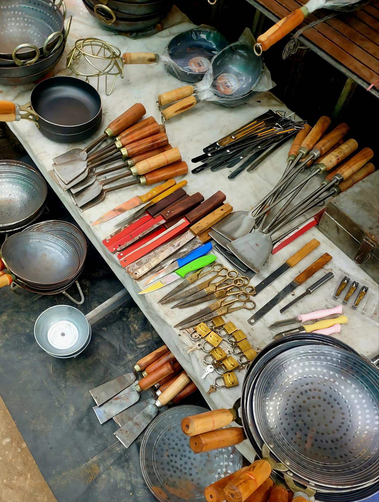 Assortment of kitchen utensils and cookware displayed on a table. — representative photo, not taken at TJ Hughes — St. Enoch