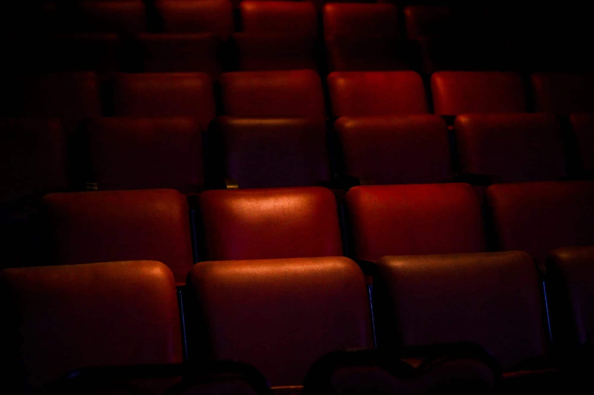 Red empty cinema chairs — representative photo, not taken at Vue cinema — St. Enoch