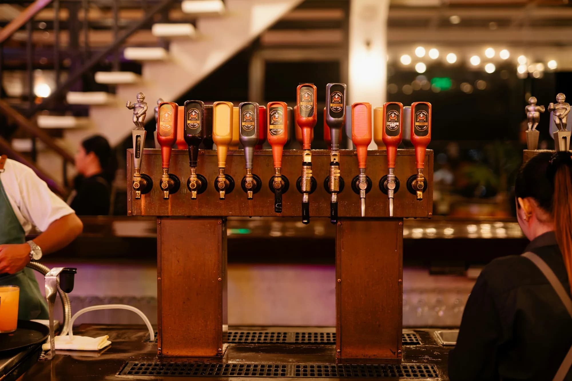 Beer taps at a bar — representative photo, not taken at WEST on the Green