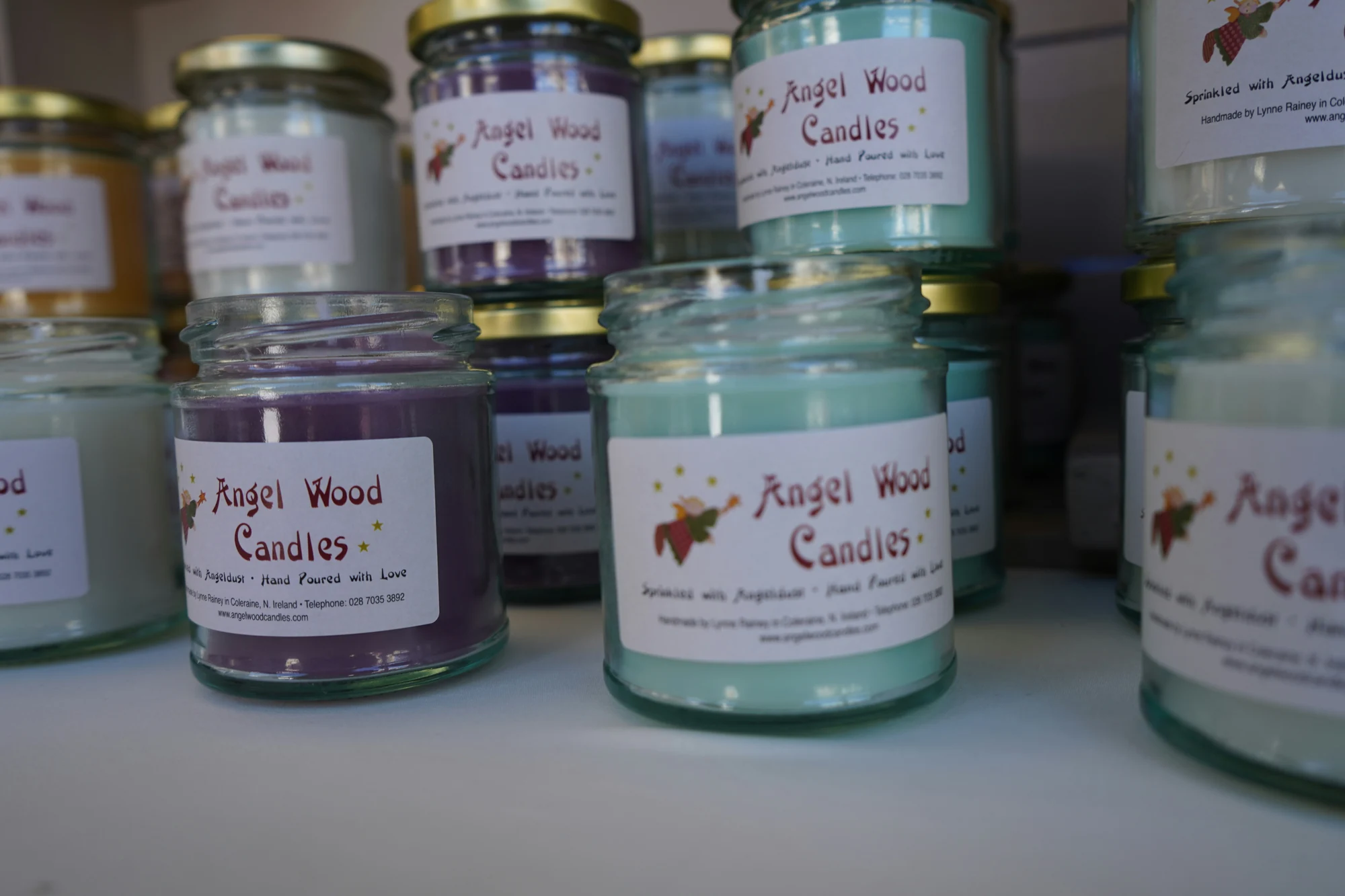 Jars of colorful scented candles on a shelf — representative photo, not taken at Yankee Candle — St. Enoch