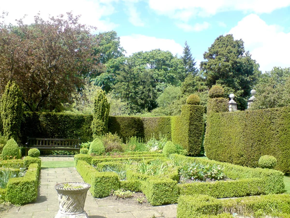 Walled garden planting and paths at Greenbank Garden, photographed in June 2012