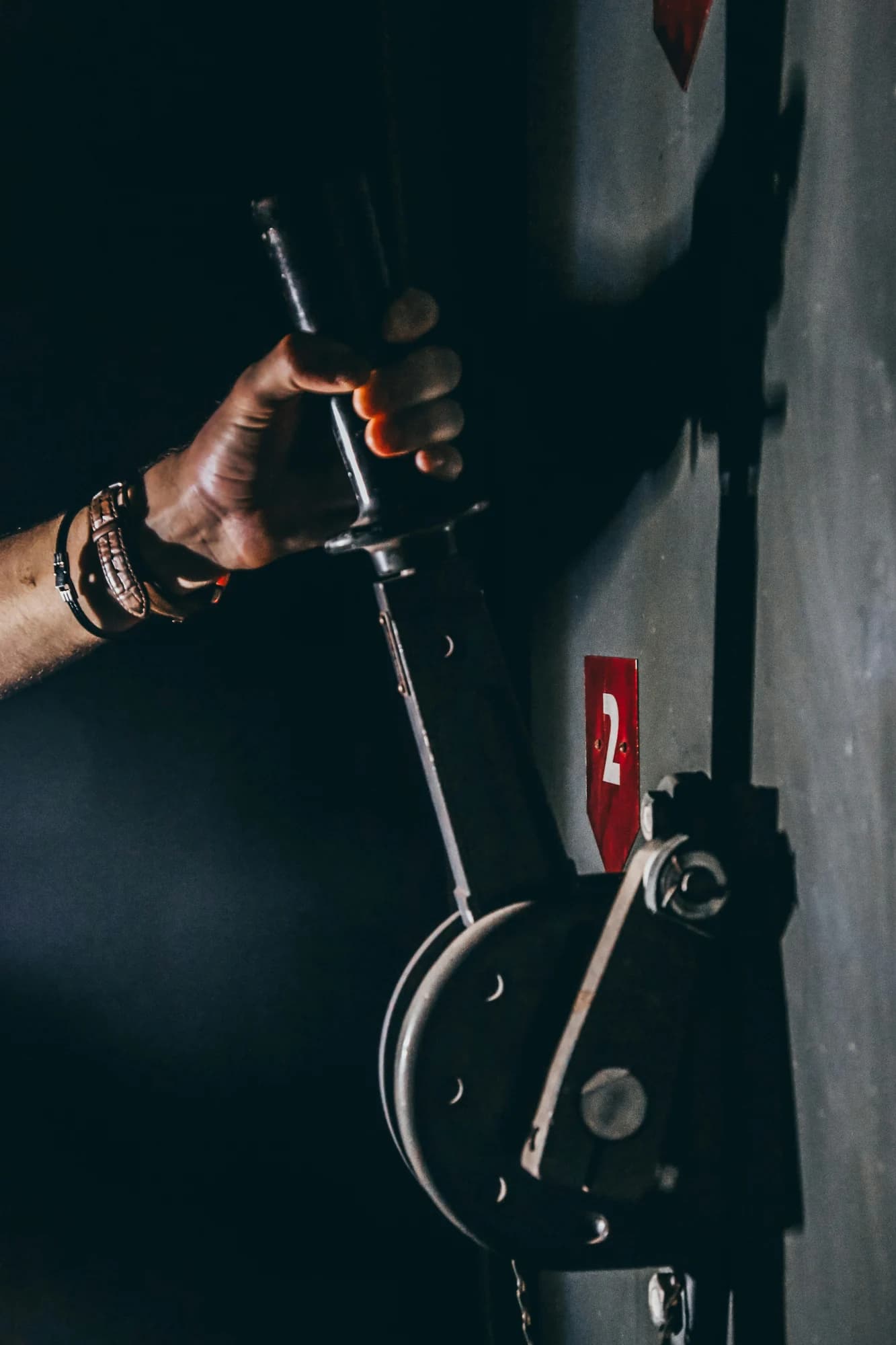 Person holding black lever — representative photo, not taken at Escape Hunt — St. Enoch